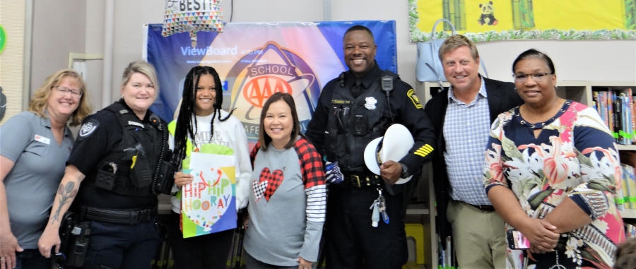 Springmyer fifth grader Addisen Dobbins with family and staff for award